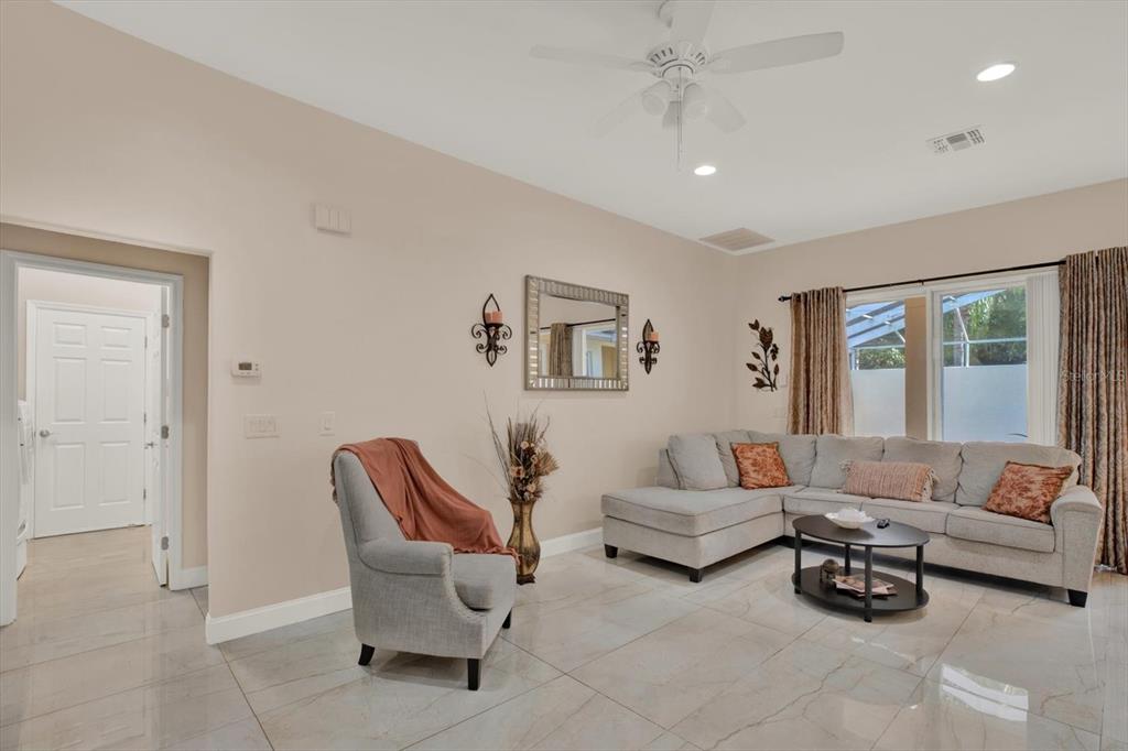 7190 Raymond Place Spring Hill, FL 34607 - Photo 18 of 41 a living room with furniture and a window