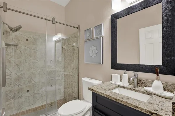 a bedroom with a bed and a couch