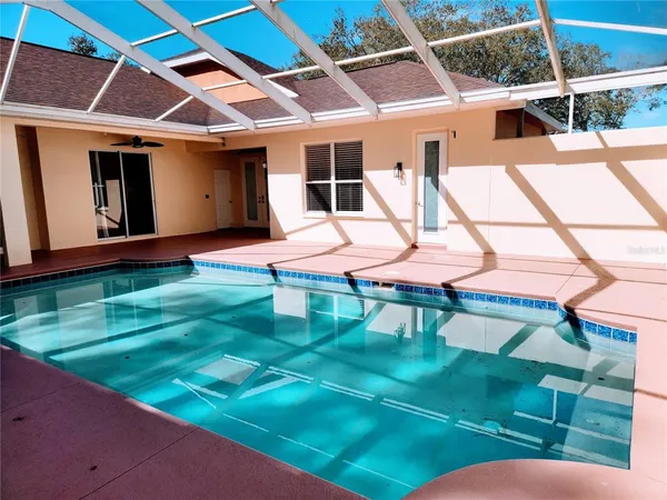 a view of a backyard of the house