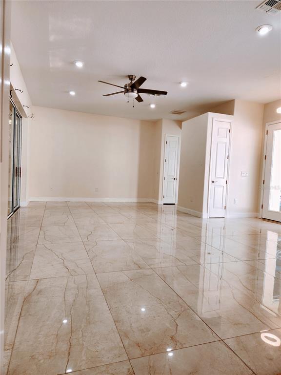 7190 Raymond Place Spring Hill, FL 34607 - Photo 8 of 41 a view of a livingroom with a garage