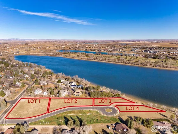 an aerial view of a house with a lake view