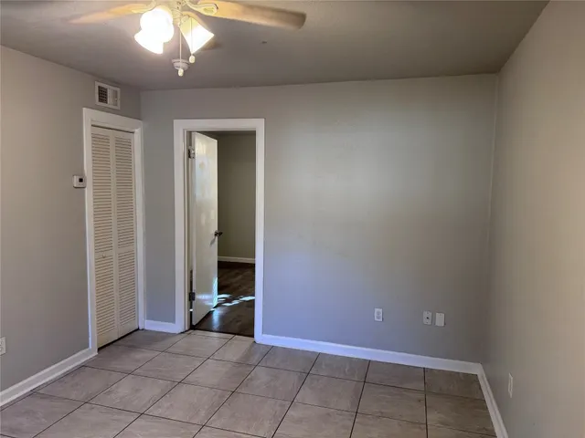 wooden floor in an empty room with a mirror