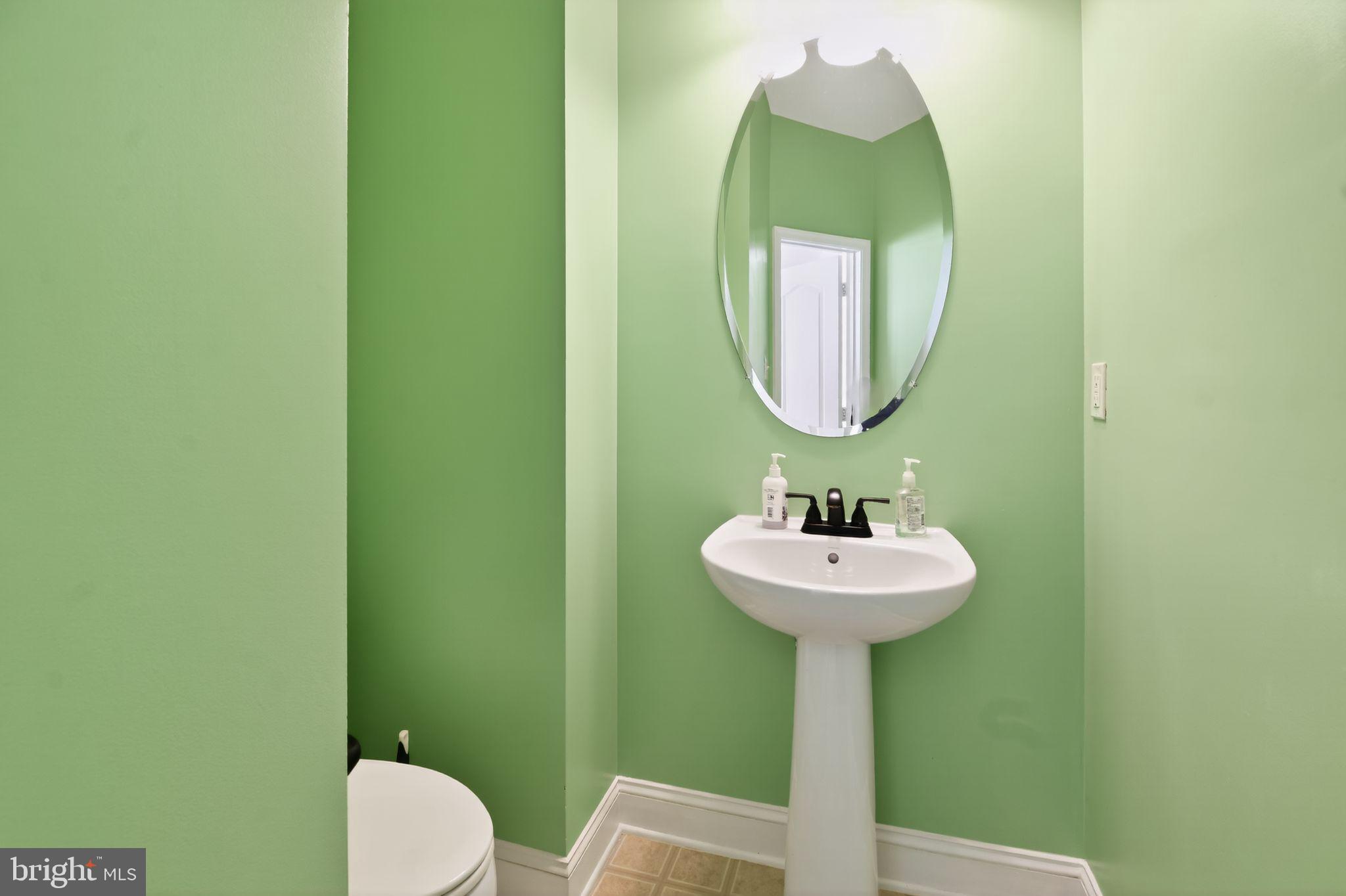 16567 Bramblewood Lane Woodbridge, VA 22191 - Photo 13 of 15 a bathroom with a sink and a mirror