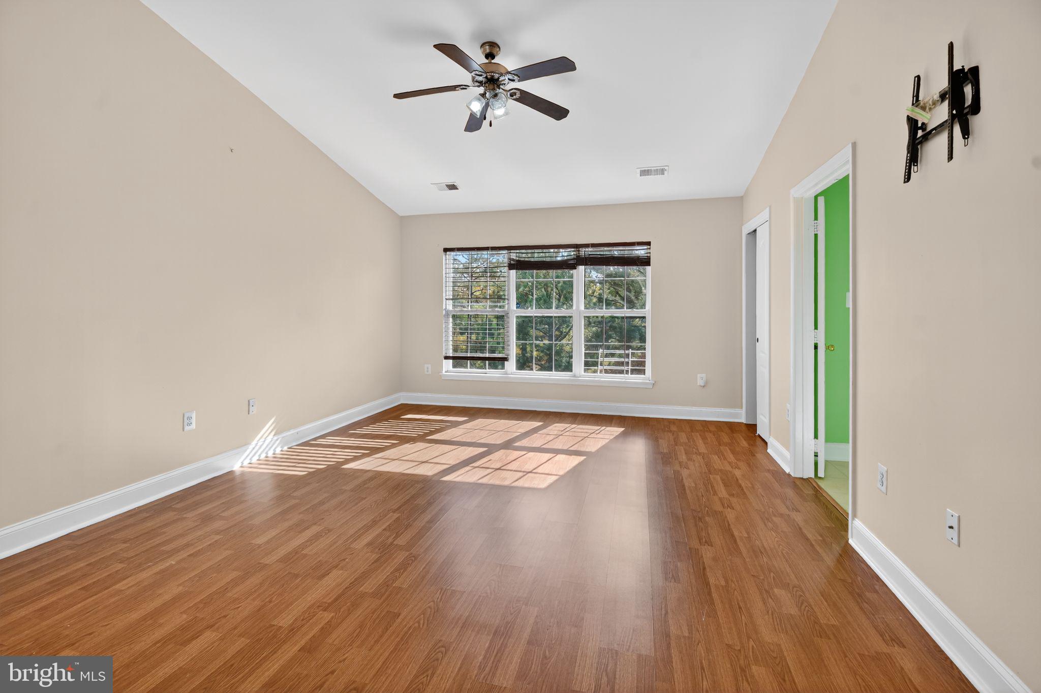 16567 Bramblewood Lane Woodbridge, VA 22191 - Photo 10 of 15 wooden floor in an empty room with a window
