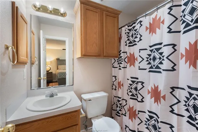 a bathroom with a toilet and a sink