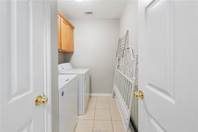 a backyard of a house with plants and wooden fence