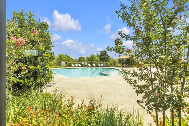 a view of a lake with a house in the background