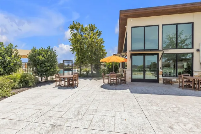 a view of a outdoor space with porch and sitting area