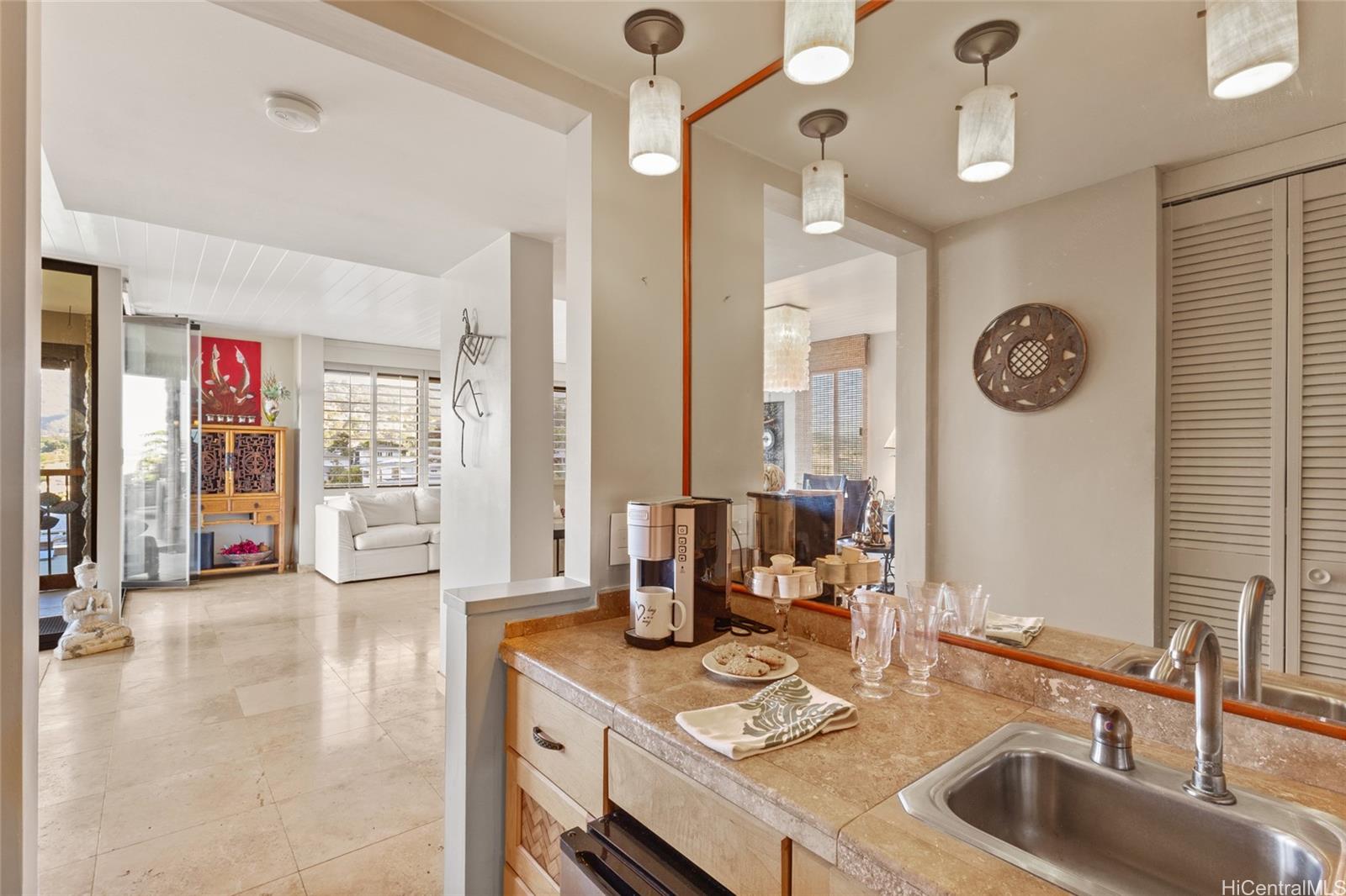 217 Prospect Street, Unit M8 Honolulu, HI 96813 - Photo 11 of 20 a very nice looking open kitchen with granite countertop a sink cabinets and a large window