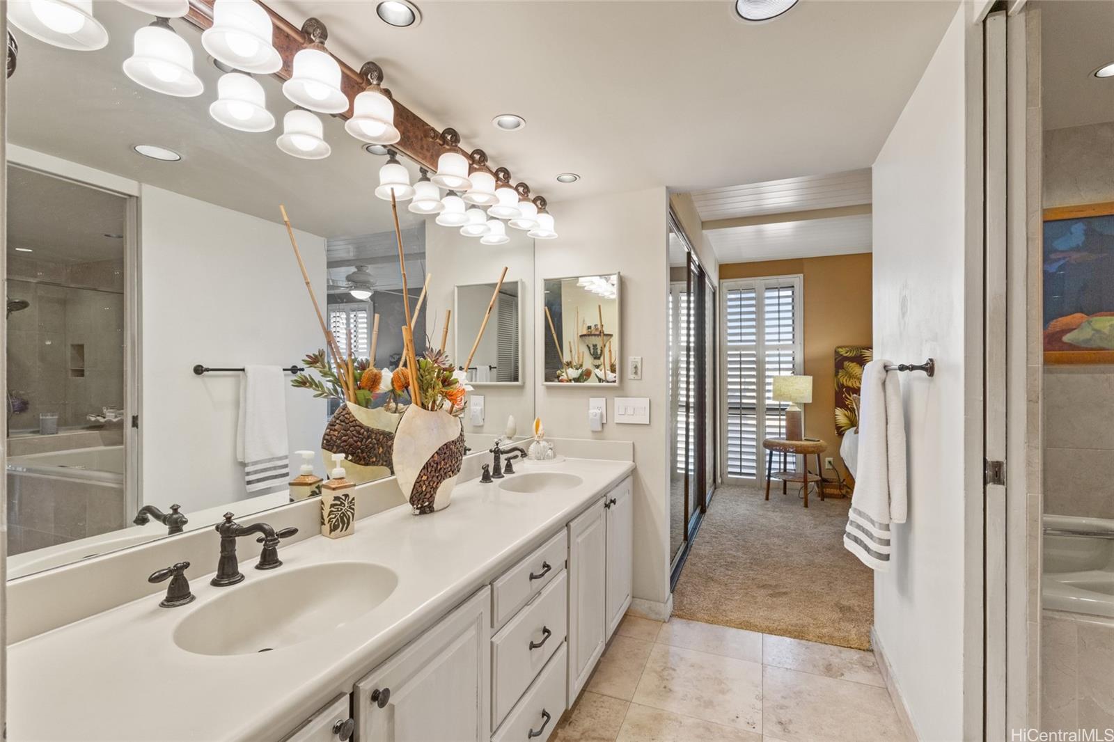 217 Prospect Street, Unit M8 Honolulu, HI 96813 - Photo 13 of 20 a spacious en suite bathroom with a double vanity sink and mirror