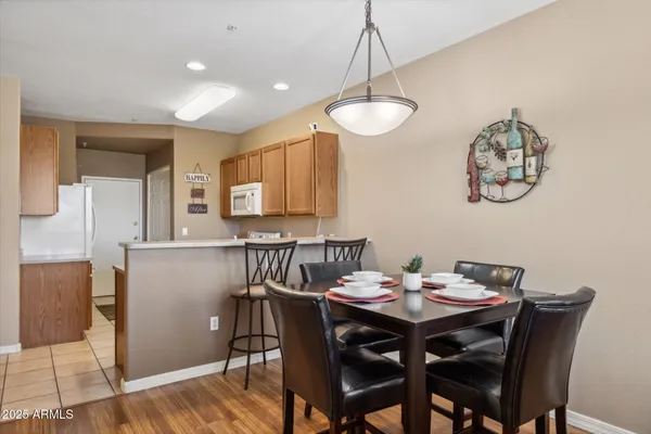 a kitchen with a sink cabinets and wooden floor
