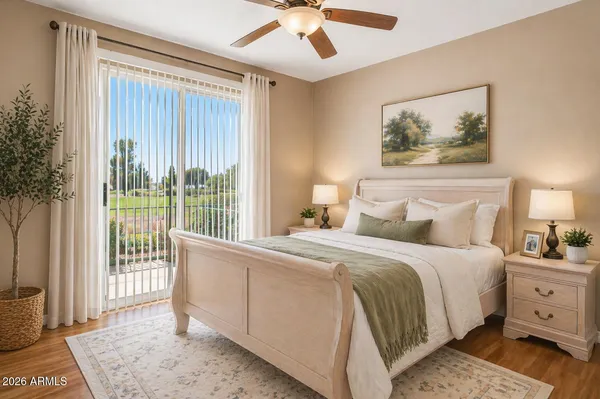 a bedroom with a bed and a chandelier