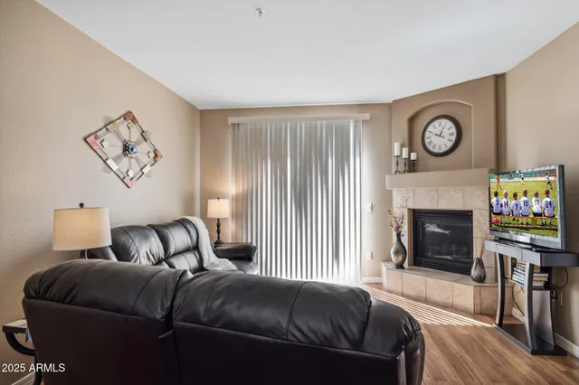 a bedroom with a bed and a fireplace