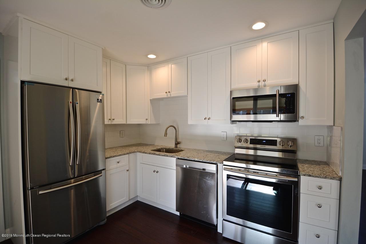 31 Berkshire Road Whiting, NJ 08759 - Photo 2 of 25 a kitchen with stainless steel appliances a refrigerator sink and microwave