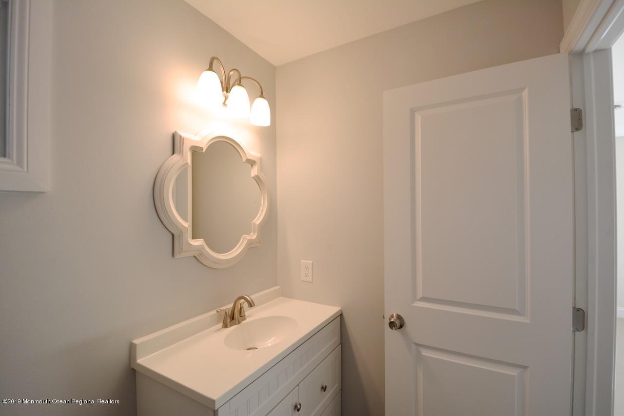 31 Berkshire Road Whiting, NJ 08759 - Photo 15 of 25 a bathroom with a sink and a mirror