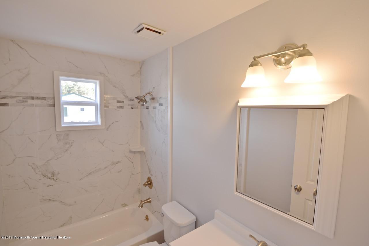 31 Berkshire Road Whiting, NJ 08759 - Photo 18 of 25 a bathroom with a granite countertop sink toilet and shower