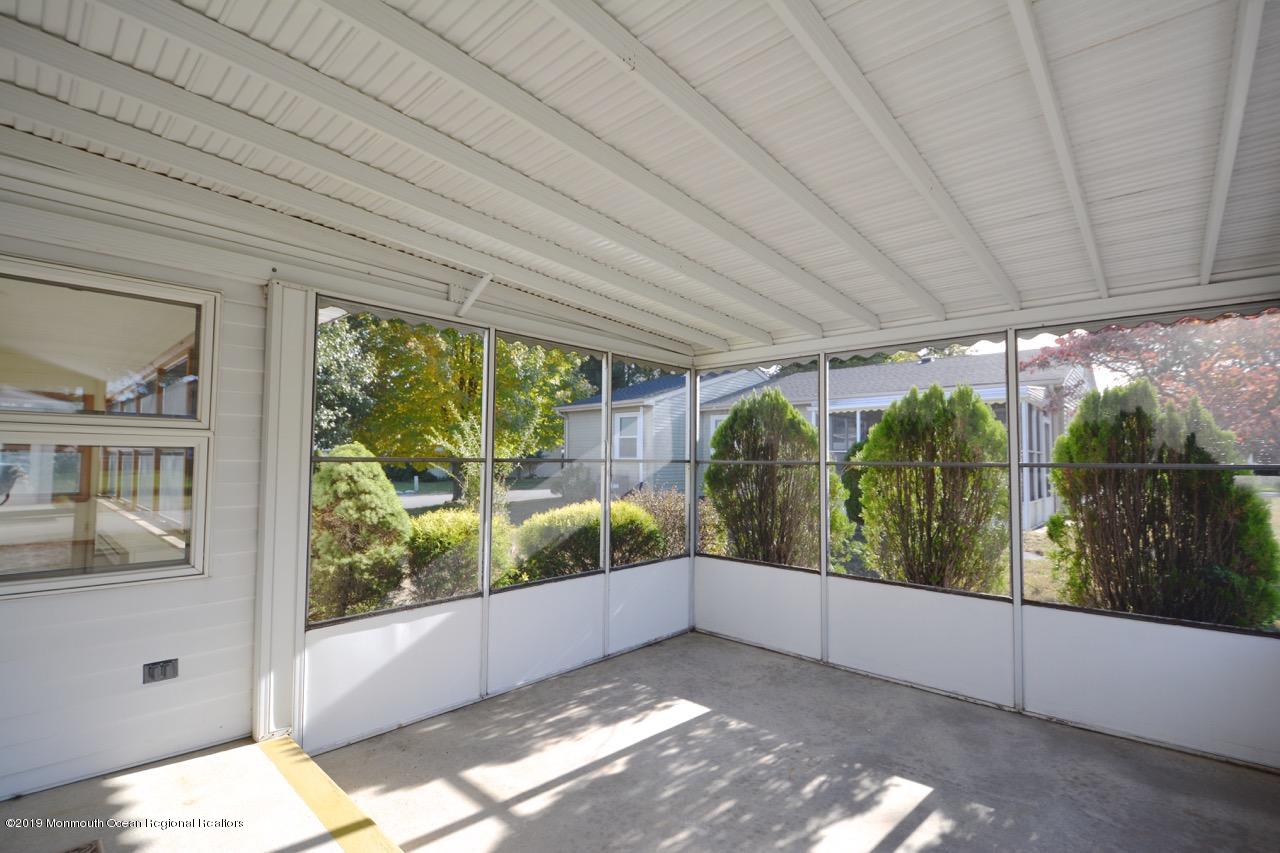 31 Berkshire Road Whiting, NJ 08759 - Photo 20 of 25 a view of a porch in front of a house with a backyard