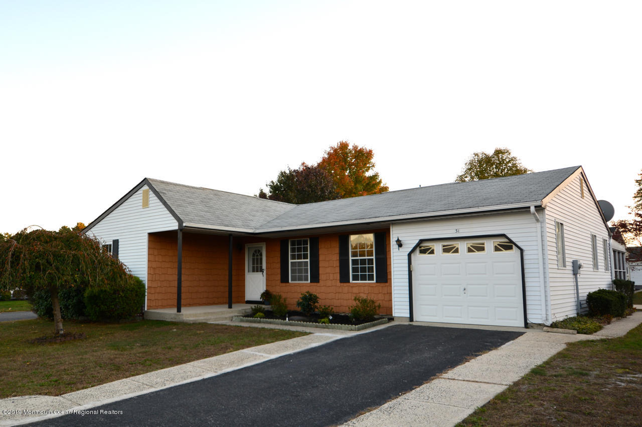31 Berkshire Road Whiting, NJ 08759 - Photo 24 of 25 a front view of a house with a yard and garage