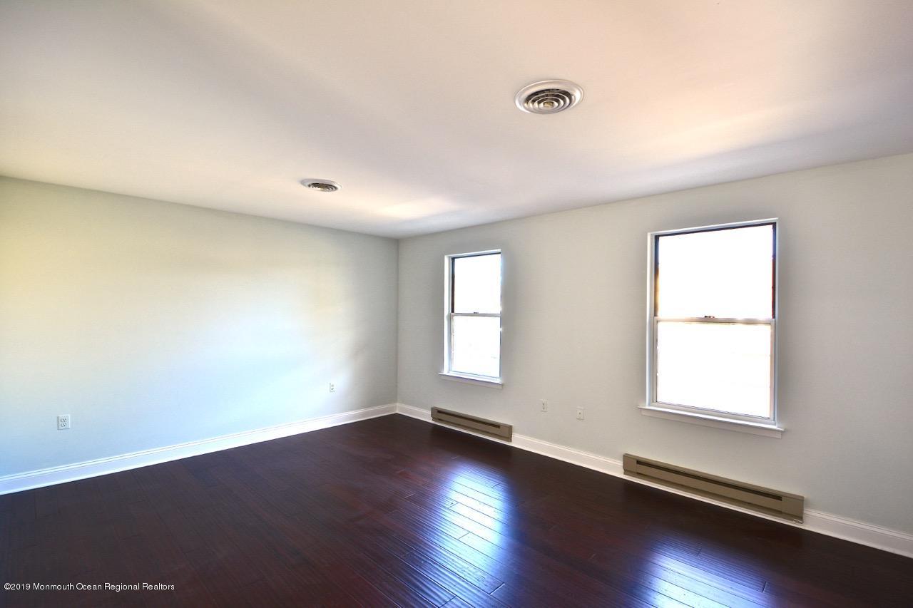 31 Berkshire Road Whiting, NJ 08759 - Photo 6 of 25 a view of an empty room with wooden floor and window