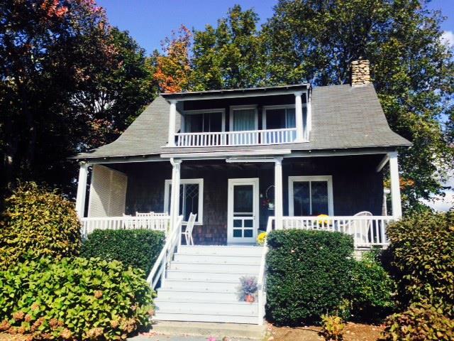 68 Middle Beach Road West Madison, CT 06443 - Photo 1 of 1 a front view of a house with garden
