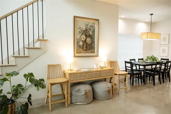 a dining room with furniture and window