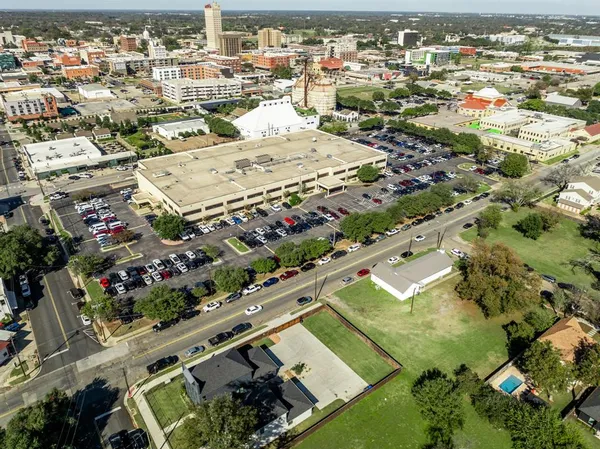 an aerial view of residential houses with outdoor space