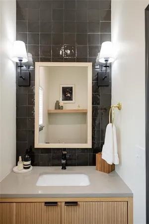 a bathroom with a sink and a mirror