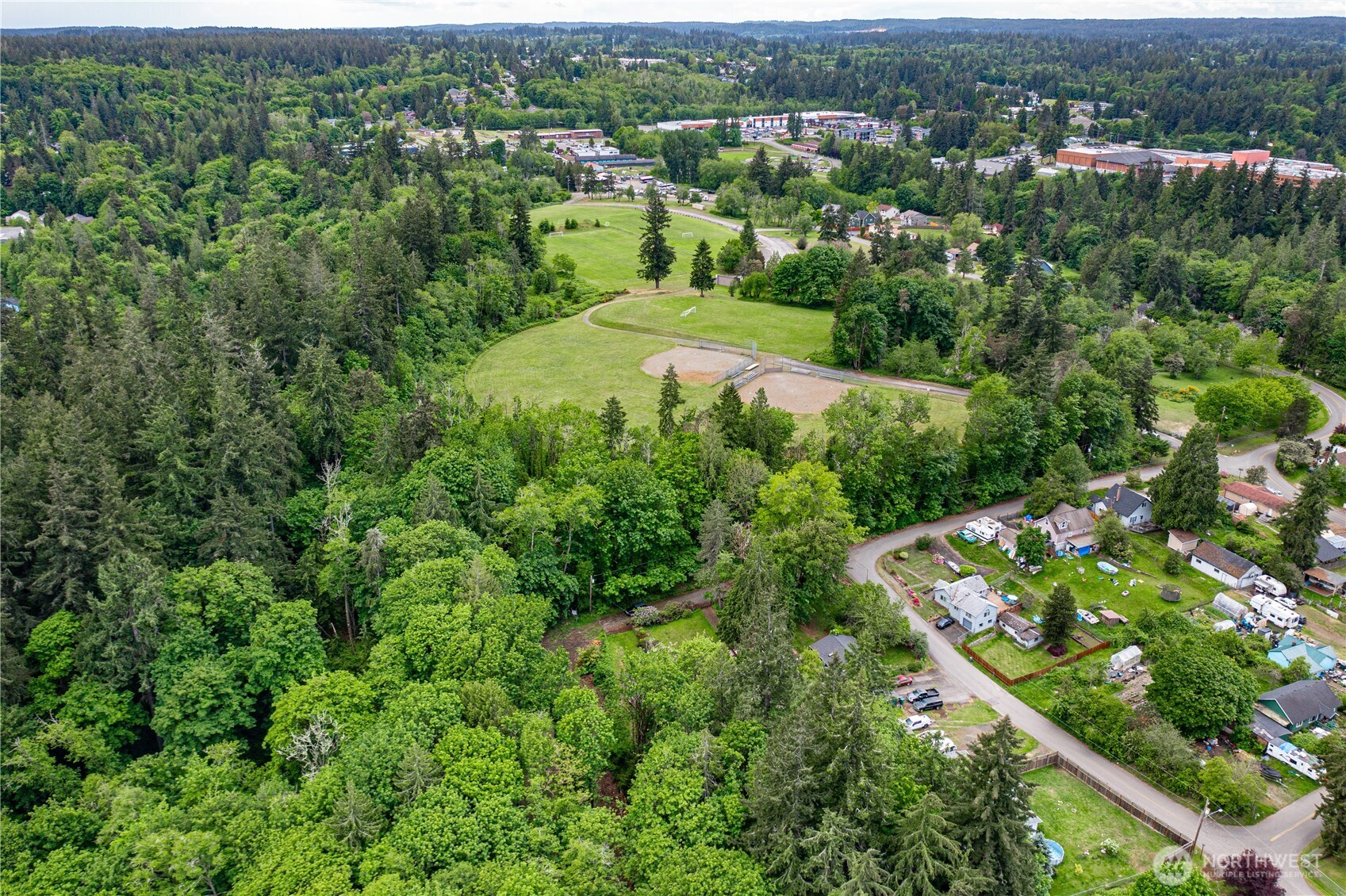 123 East 4th Street Port Orchard, WA 98366 - Photo 12 of 16 an aerial view of residential houses with outdoor space and trees