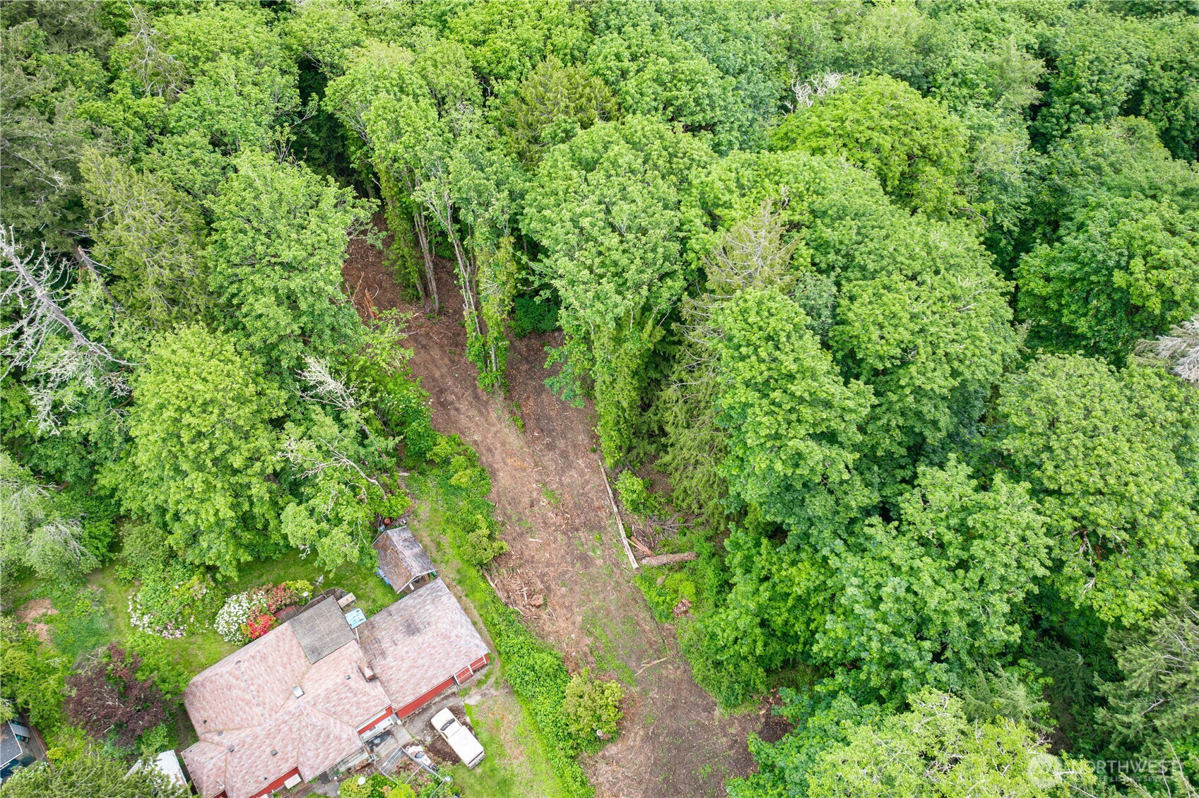123 East 4th Street Port Orchard, WA 98366 - Photo 7 of 16 an aerial view of residential house with outdoor space and trees all around