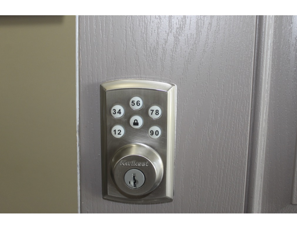 188 Beth Ann Loop Taylor, TX 76574 - Photo 11 of 12 Secure entry is provided by a modern electronic lock.