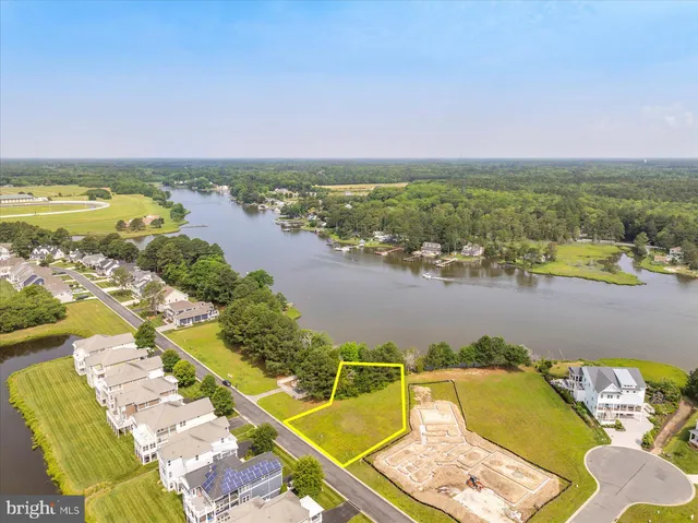 an aerial view of a house with a swimming pool