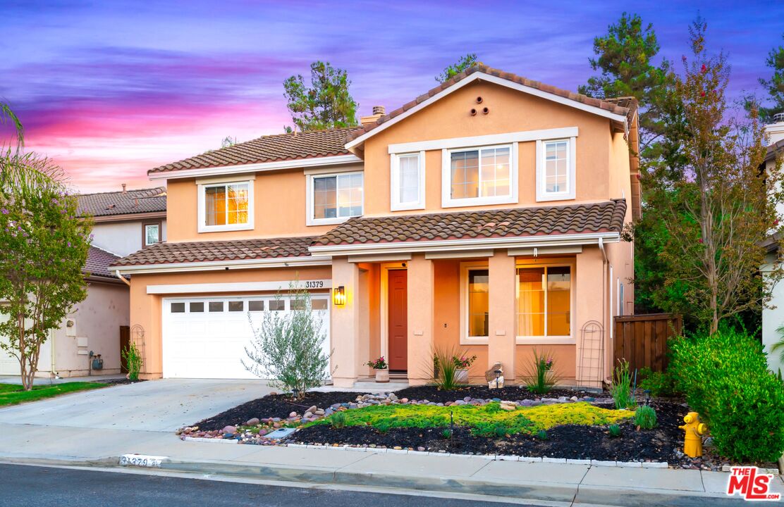31379 Seminole Street Temecula, CA 92591 - Photo 1 of 1 a front view of a house with a yard and garage