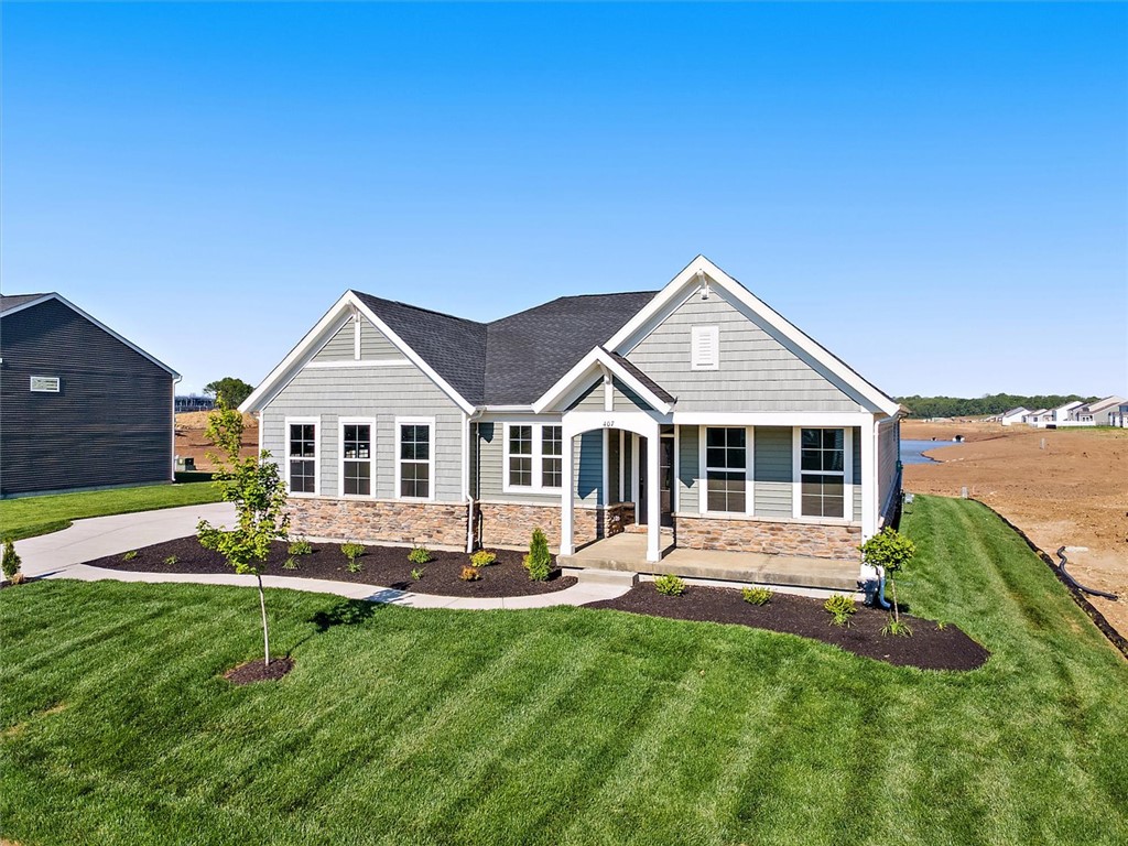 407 South Landon Lane Springfield, OH 45502 - Photo 22 of 30 Crafted with stone and siding, this charming residence offers inviting curb appeal and a neatly landscaped front yard.
