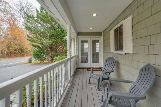 a view of a chair and table in the balcony