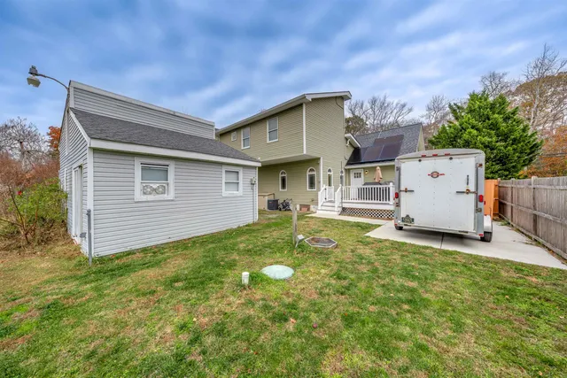 a view of a house with a backyard