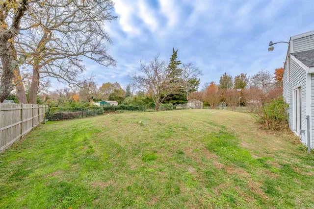 a view of a field with of house