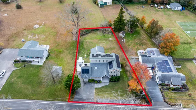 an aerial view of houses with yard