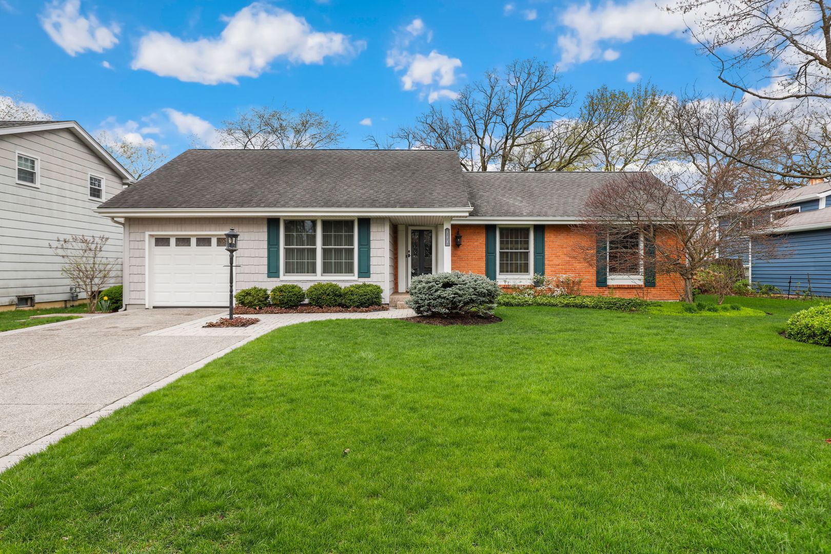 518 Northgate Road Lindenhurst, IL 60046 - Photo 1 of 35 a front view of a house with a yard and trees