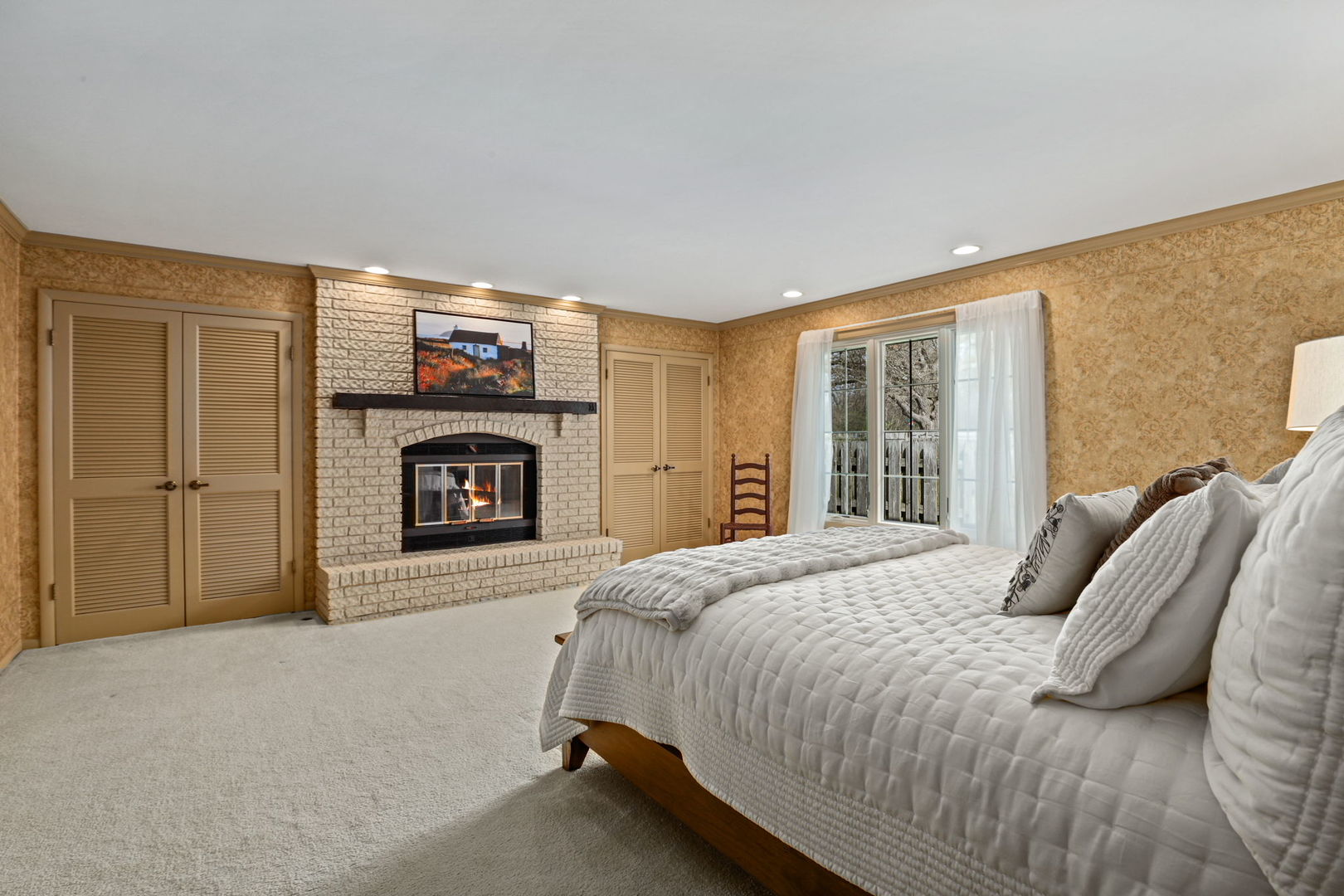 518 Northgate Road Lindenhurst, IL 60046 - Photo 15 of 35 a bedroom with a bed and a fireplace