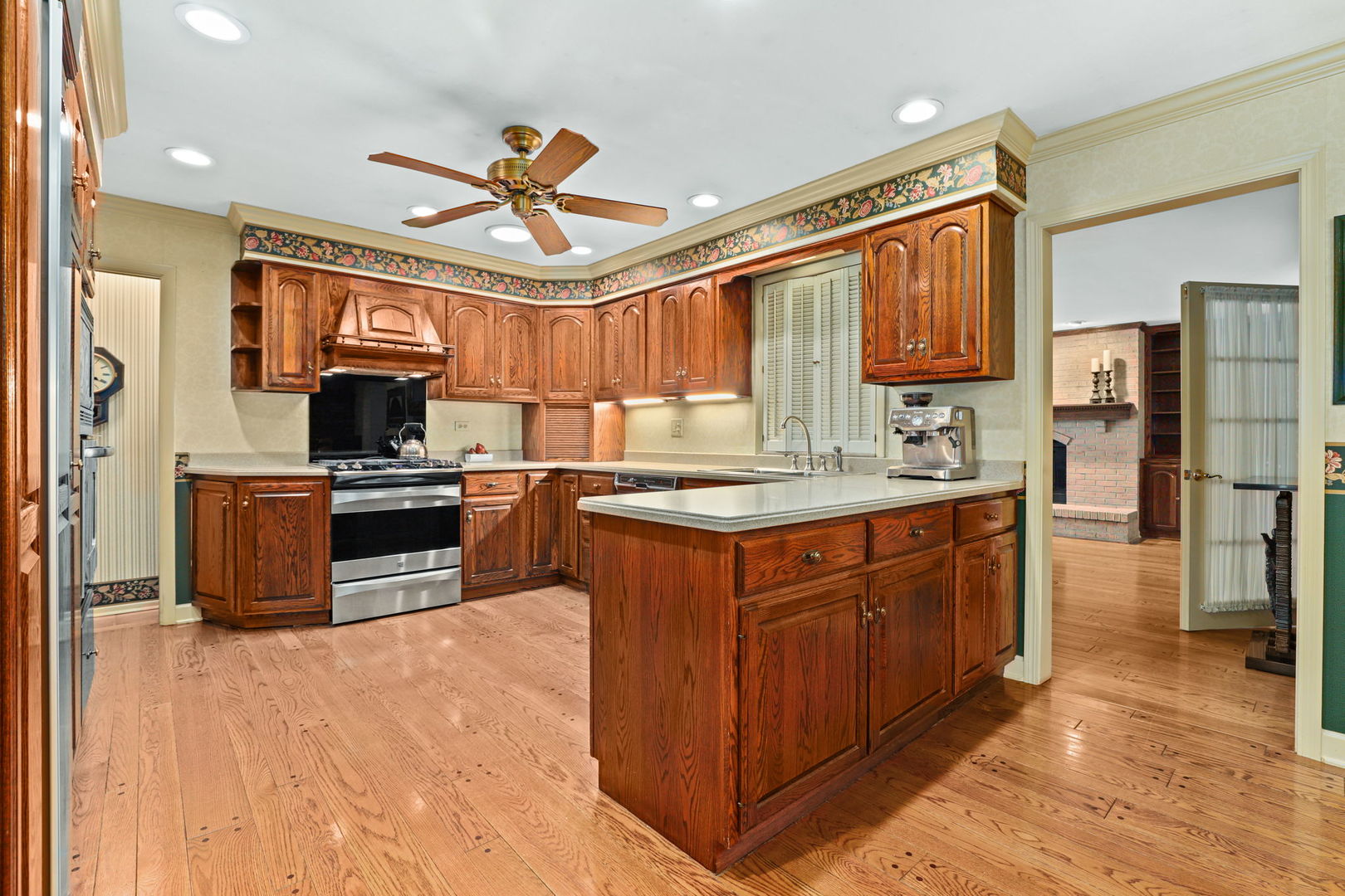 518 Northgate Road Lindenhurst, IL 60046 - Photo 8 of 35 a kitchen with stainless steel appliances granite countertop a stove refrigerator sink and cabinets