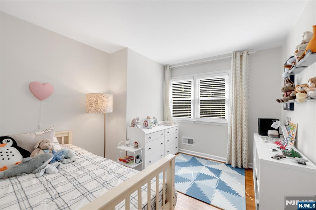 433 Piermont Road Cresskill, NJ 07626 - Photo 23 of 49 a bedroom with a bed and a window