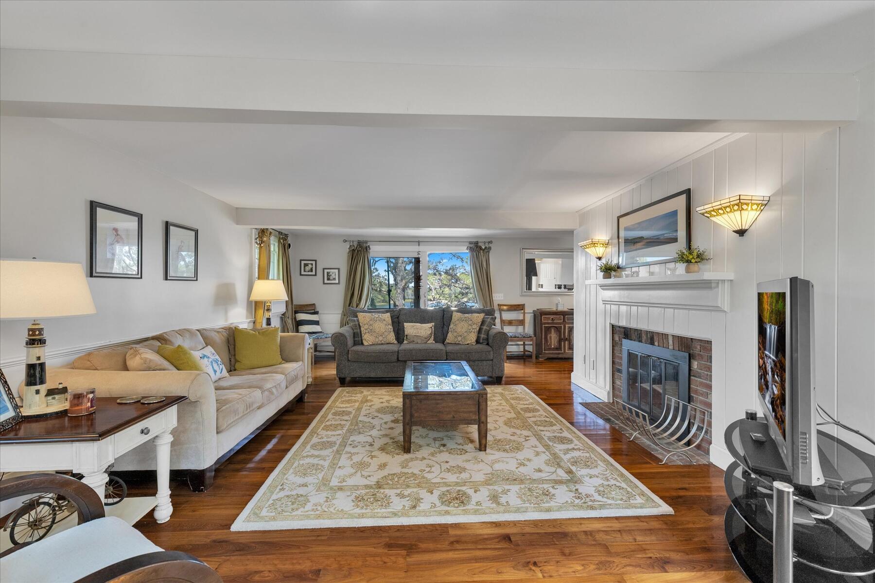 194 John Joseph Road Harwich, MA 02645 - Photo 11 of 87 a living room with furniture and a fireplace