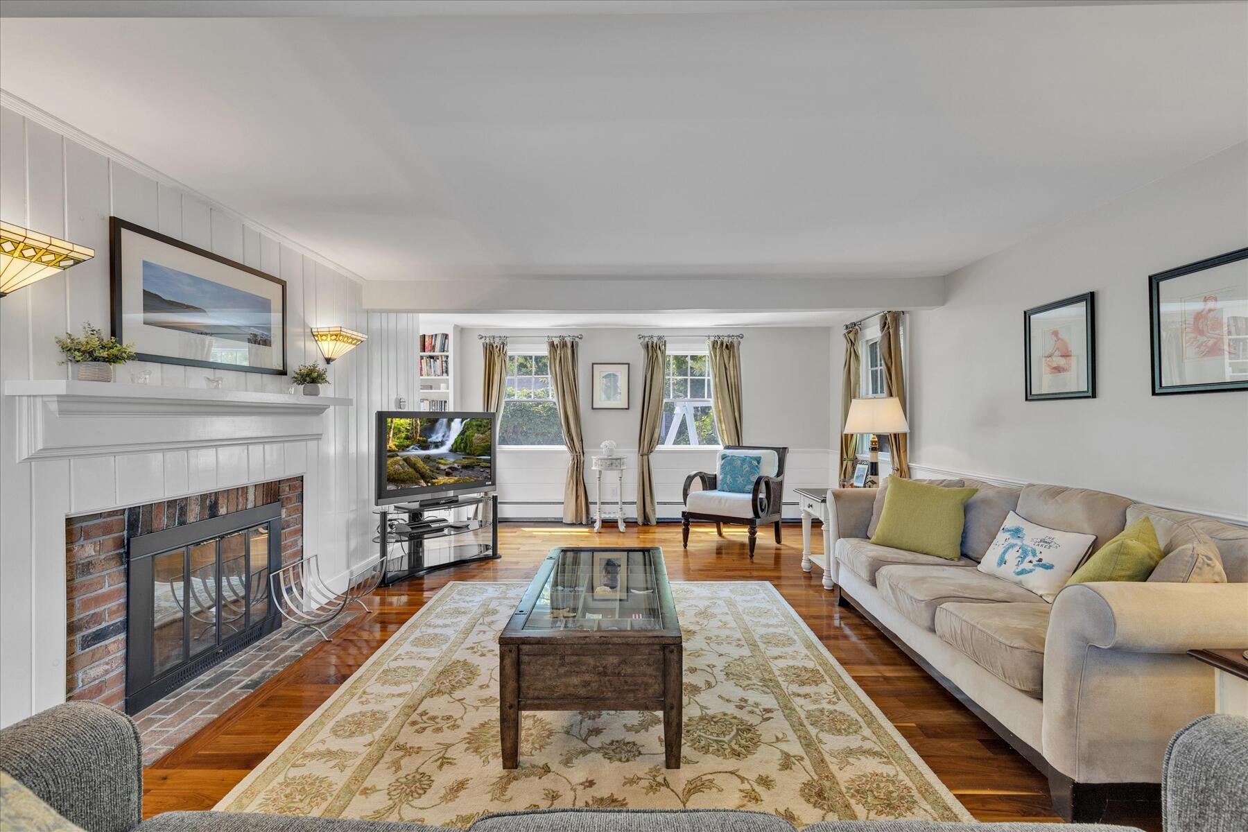194 John Joseph Road Harwich, MA 02645 - Photo 12 of 87 a living room with furniture and a fireplace