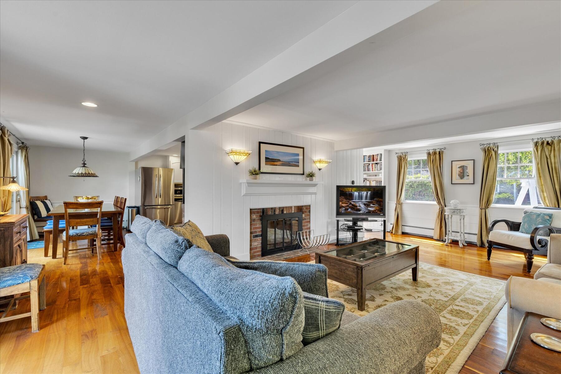194 John Joseph Road Harwich, MA 02645 - Photo 13 of 87 a living room with fireplace furniture and a wooden floor
