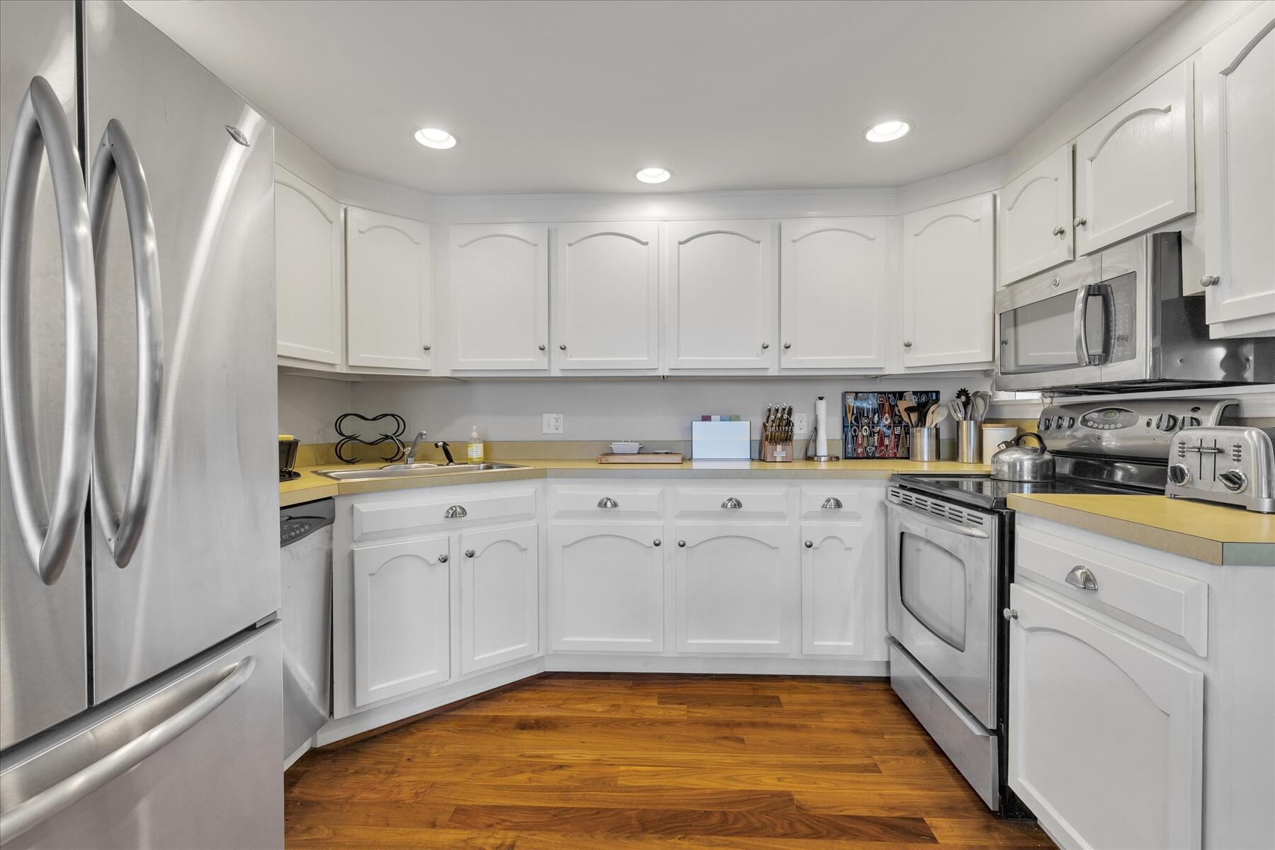 194 John Joseph Road Harwich, MA 02645 - Photo 17 of 87 a kitchen with stainless steel appliances granite countertop refrigerator sink and cabinets