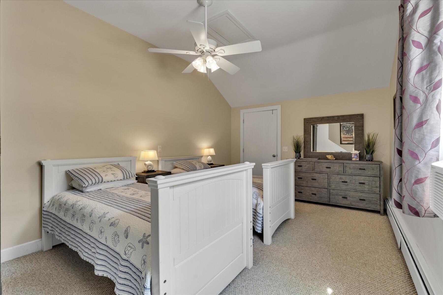 194 John Joseph Road Harwich, MA 02645 - Photo 34 of 87 a bed room with a bed and a chandelier