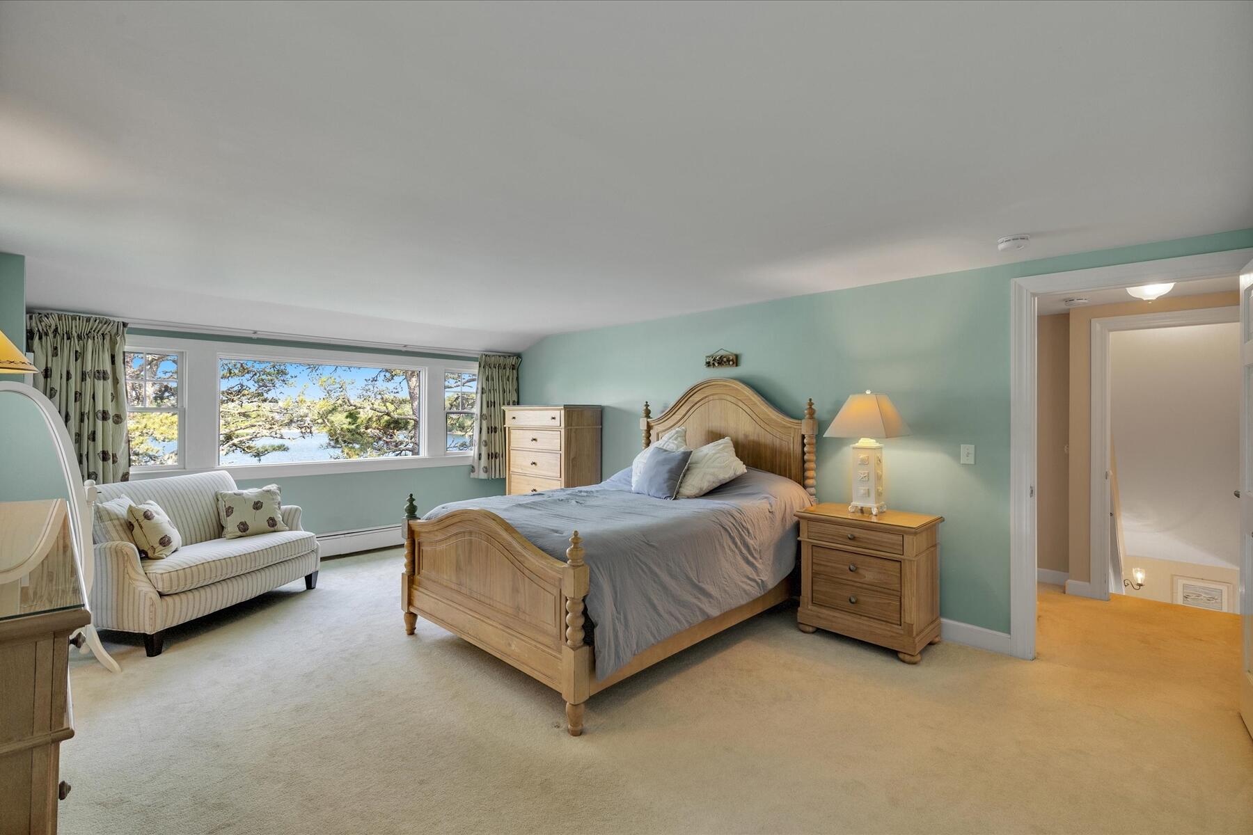 194 John Joseph Road Harwich, MA 02645 - Photo 42 of 87 a spacious bedroom with a bed and a couch