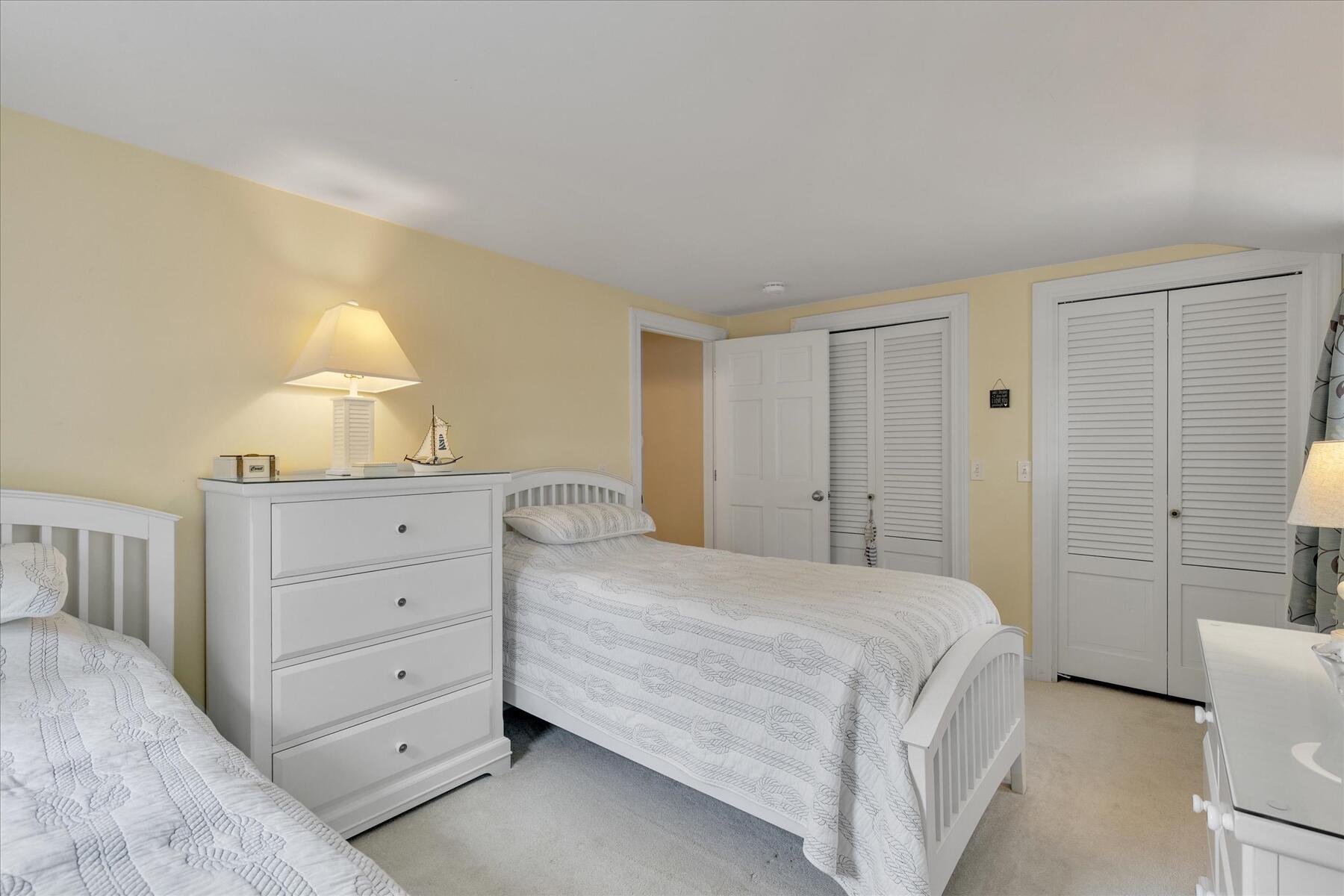 194 John Joseph Road Harwich, MA 02645 - Photo 49 of 87 a bedroom with a bed and a dresser in it