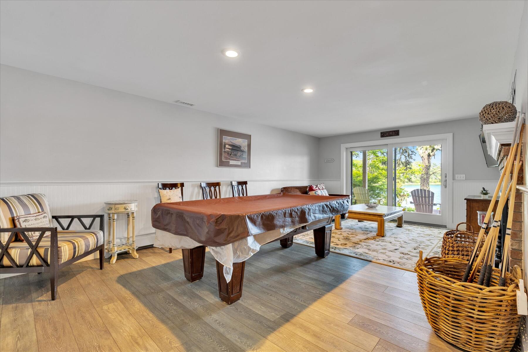 194 John Joseph Road Harwich, MA 02645 - Photo 62 of 87 a spacious bedroom with a bed a couch and a table in it