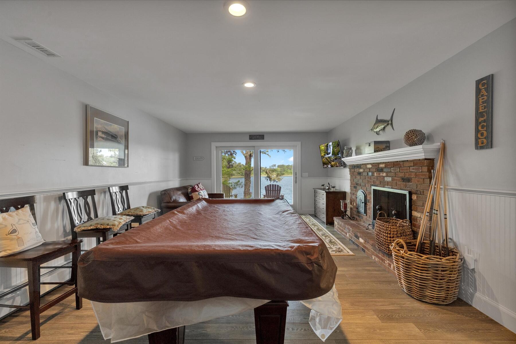 194 John Joseph Road Harwich, MA 02645 - Photo 63 of 87 a living room with furniture a fireplace and a table